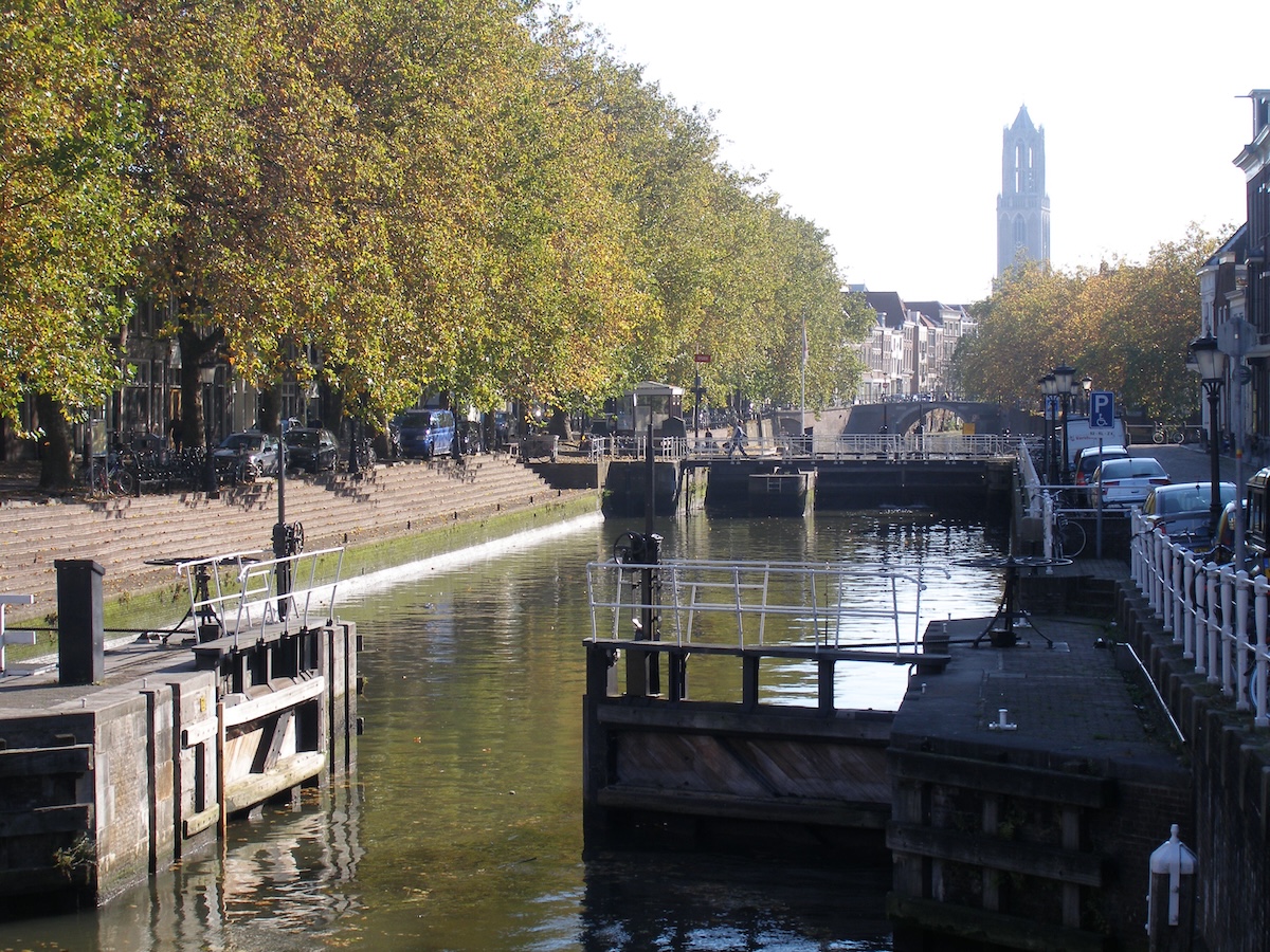 The Weerdsluis lock in Utrecht connecting the Oudegracht to the river Vecht. The Dom tower is in the background.